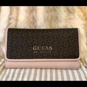 Guess slim logo clutch wallet.